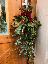 Festive door hand tied decoration